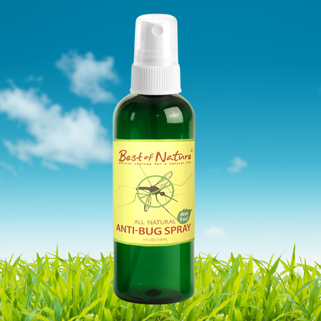 Bottle of 'Best of Nature' anti-bug spray with a green label against a blue sky and grass background.
