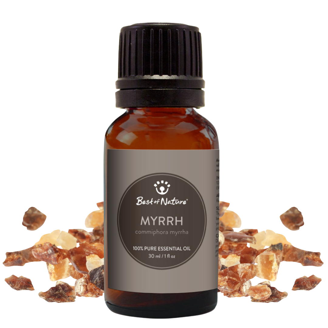 Myrrh essential oil bottle with myrrh resin on a white background