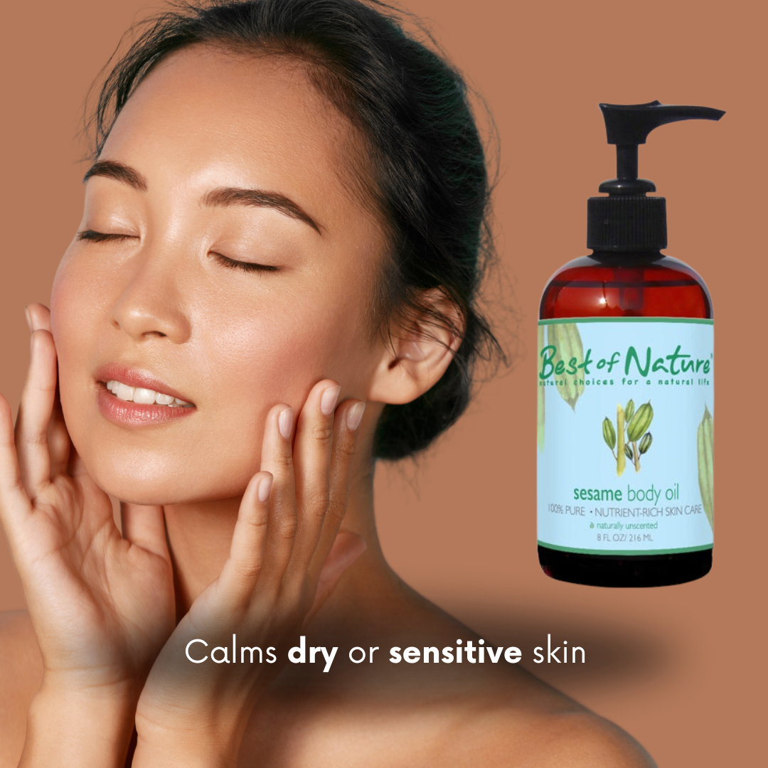 Woman touching her face. A bottle of 'Best of Nature' sesame body oil next to her. Brown background with text ' Calms dry or sensitive skin'.